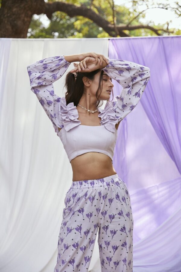 Embrace summer vibes in this whimsical, cotton block printed top with detachable sleeves. Its cool purple hue adds a touch of enchantment to your casual outings